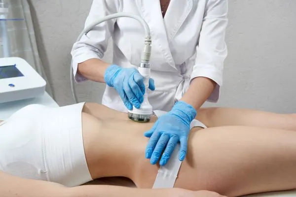 Lost the Weight but Not the Loose Skin? 2 woman having HIFU treatment on her stomach to combat loose skin England following weight loss